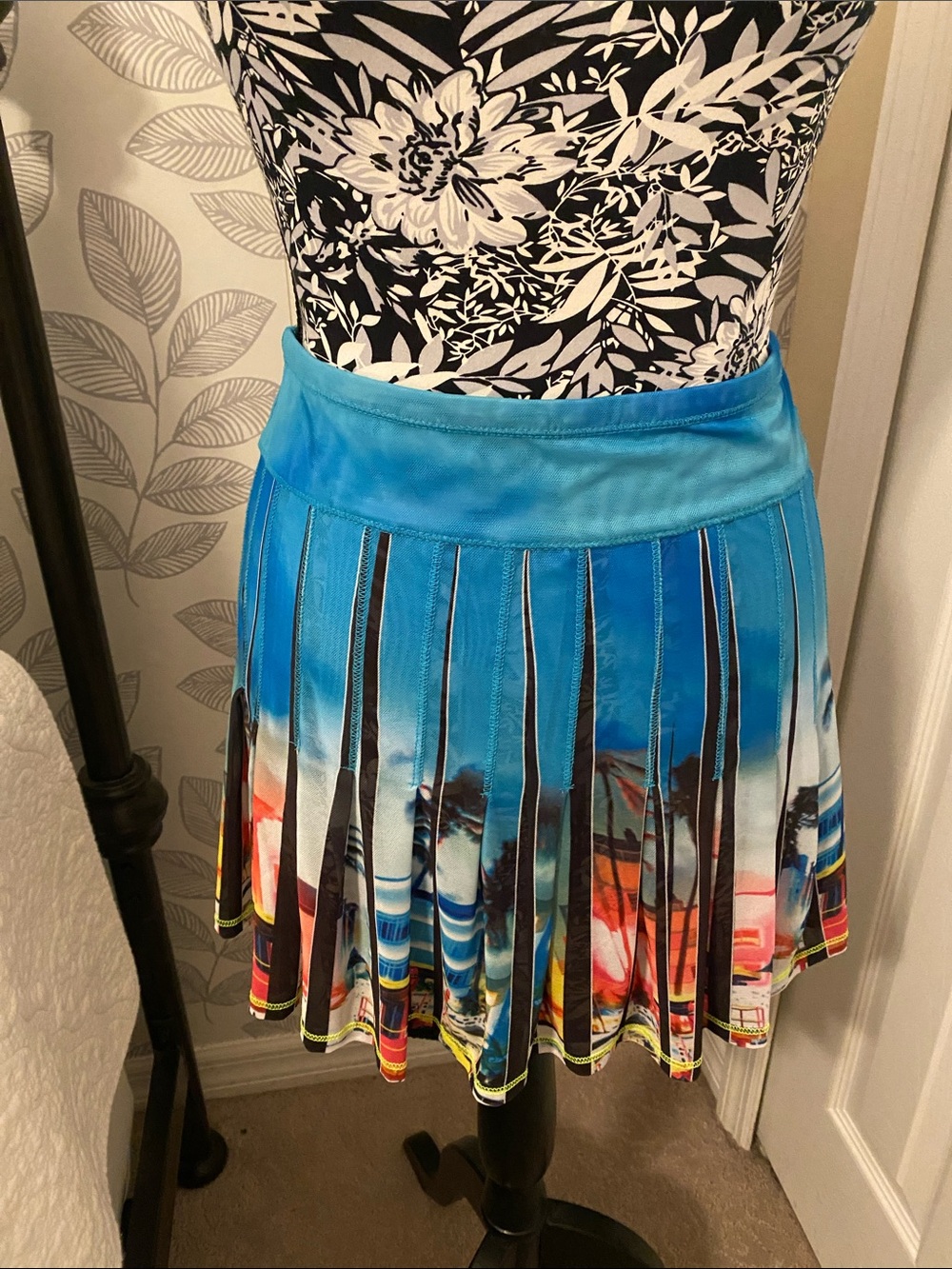 Lucky in Love Sheer pleated performance skirt featuring a Beach Postcard print
